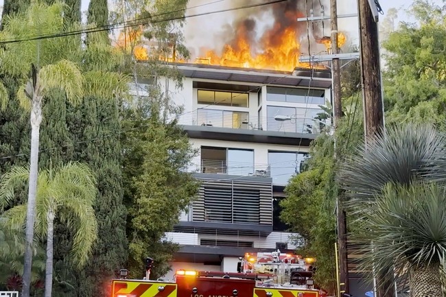 Inferno erupts at Hollywood Hills mansion as flames rip through roof