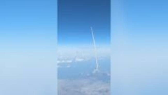 Passengers watch Artemis II blast off from commercial plane