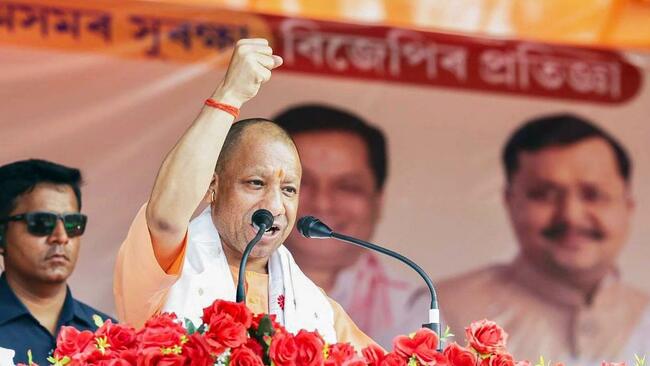 In poll-bound Assam, Adityanath stresses U.P. model of dealing with rioters