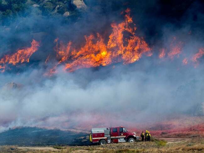 Crews battle fast-growing wildfire in windy Southern California that’s forced some to evacuate