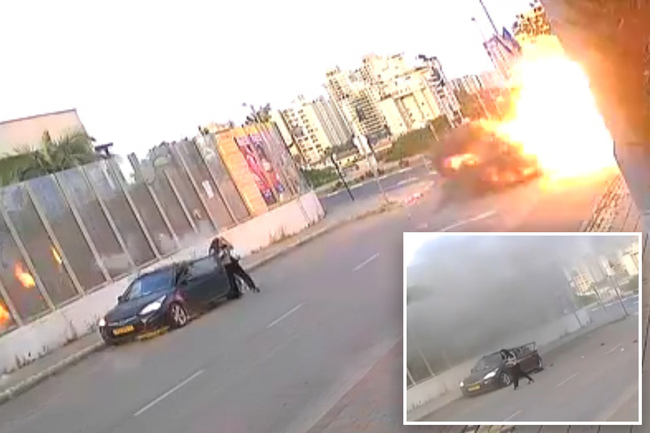 Dramatic moment Israeli woman knocked to the ground as missile explodes next to her — before getting up and walking away