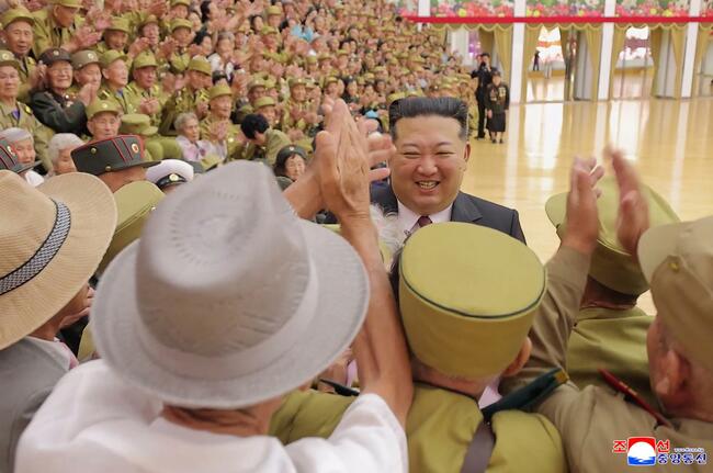 N. Korea's Kim takes photos with war veterans to celebrate armistice anniversary