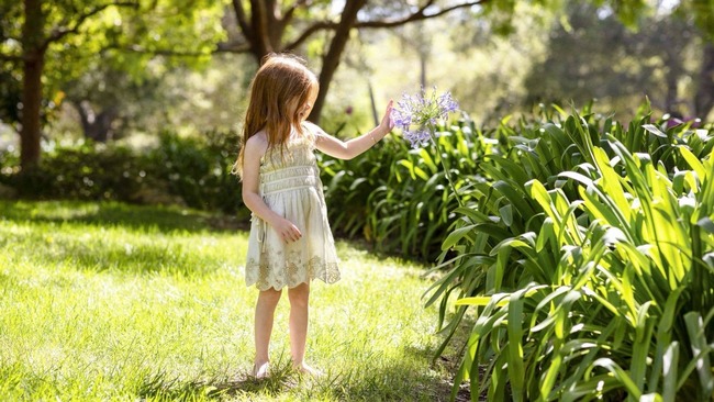 Princess Lilibet steals the show in mini cowboy boots - and the longest Disney hair