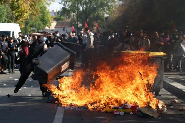 Teacher doused in petrol and schools set on fire as student riots in France dramatically escalate