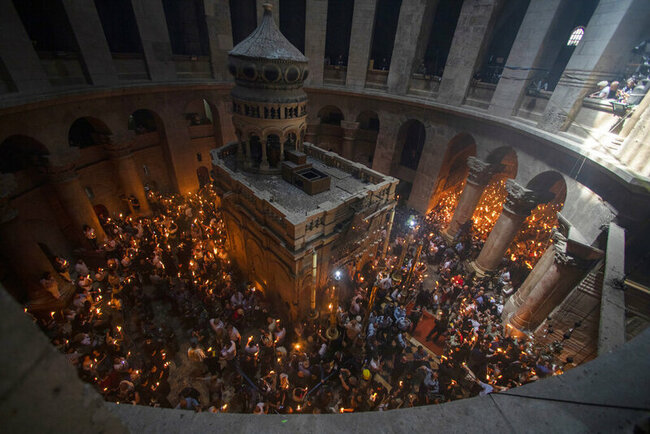 Vaccinated faithful throng Jerusalem church for Holy Fire
