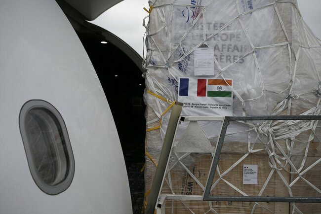 The Latest: May Day marchers: Job protections amid pandemic