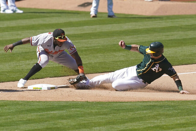 Laureano saves A's with glove, then hits decisive HR vs O's