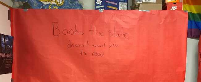 Teacher quits in protest after being punished for banned books sign