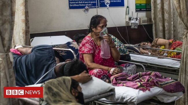 India says infections 'slowing down' as it passes 20 million cases