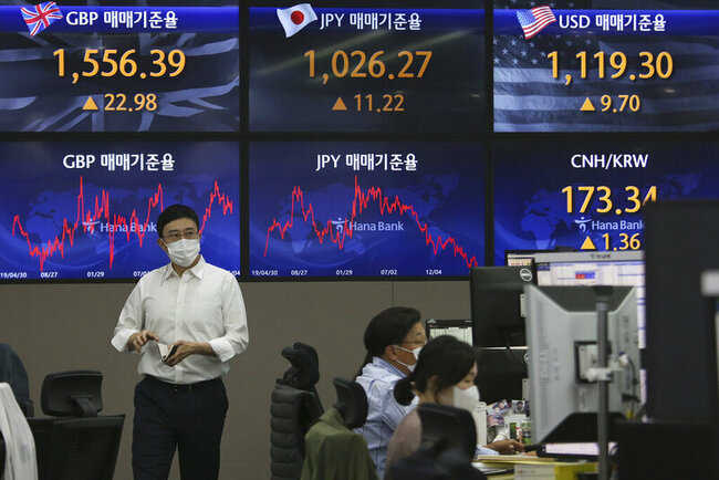 Asian shares mixed after strong earnings, data lift Wall St