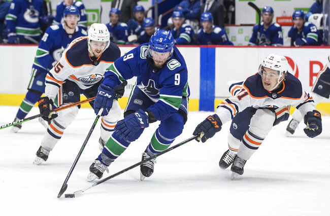 McDavid help Oilers beat Canucks 5-3 to clinch playoff spot