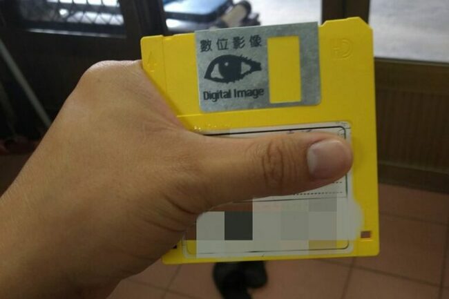 Grandma asks grandson for help developing photos using 'save icon'