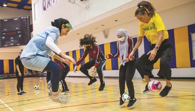 QF students learn to express themselves, using a football