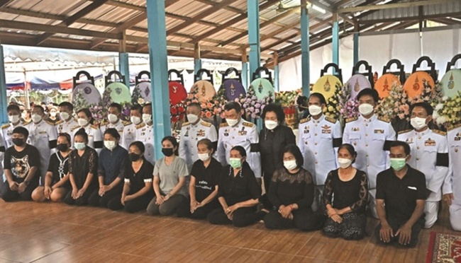 Kin of Thai massacre victims pray as king shares his grief