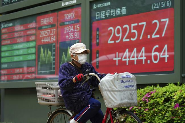 Asian stocks mostly higher on hopes for pandemic recovery